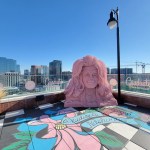 giant pink sculpture of Dolly Parton's head sits atop The Graduate Hotel in Nashville