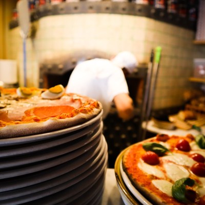 Pizza coming out of the oven at Taverna 51