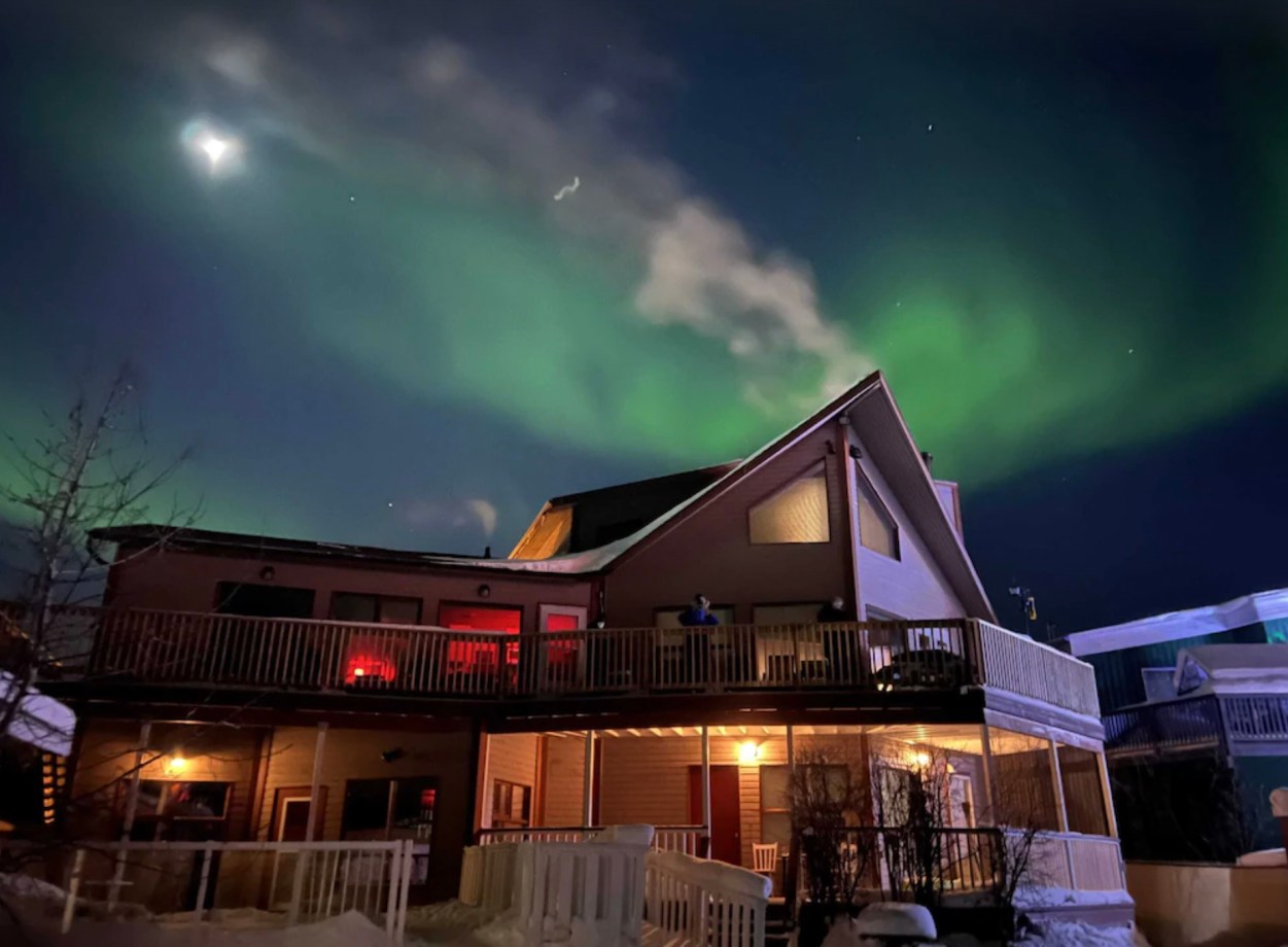 View of the northern lights from The Aurora Bayside Inn rental in Canada
