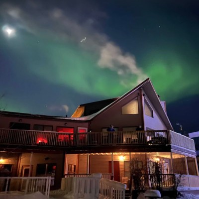 View of the northern lights from The Aurora Bayside Inn rental in Canada