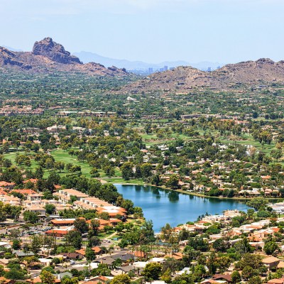 Aerial view from Scottsdale to Phoenix, Arizona above golf course and upscale homes