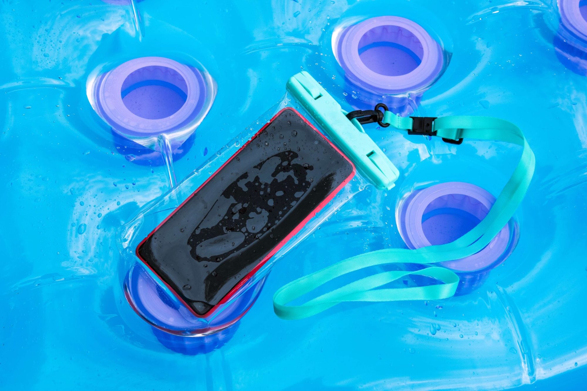 Cell phone in waterproof phone case on a pool raft