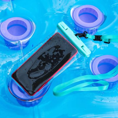 Cell phone in waterproof phone case on a pool raft