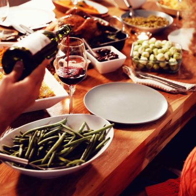 Pouring wine at the Thanksgiving table