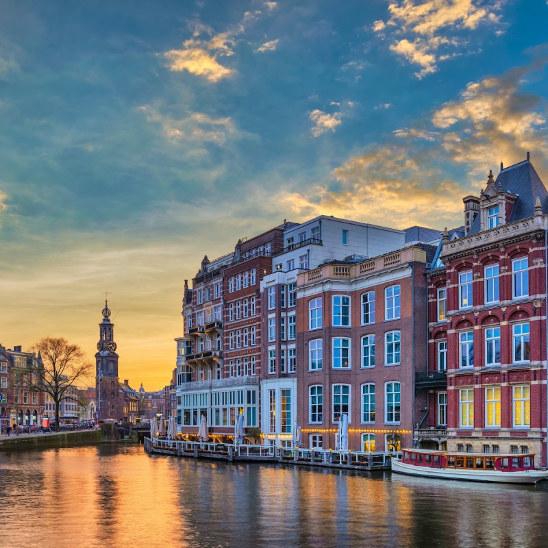 The Dutch houses bordering a canal in Amsterdam, Netherlands