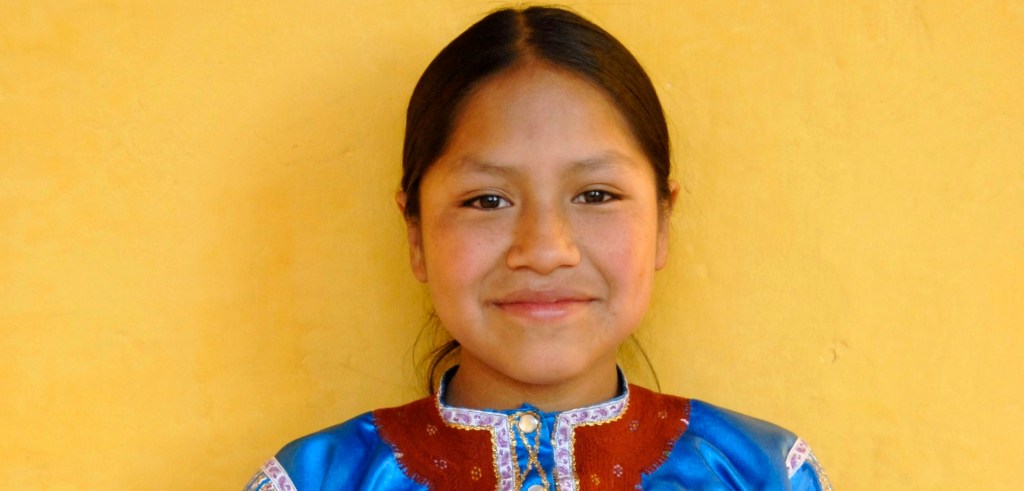 A Chiapas girl wears the traditional colors of her village.