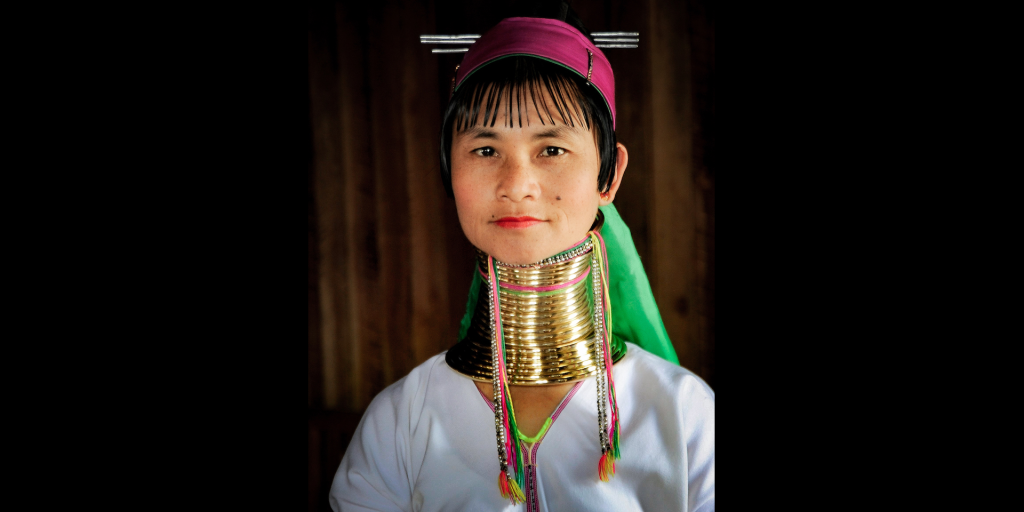 A Padaung woman wears brass neck rings.