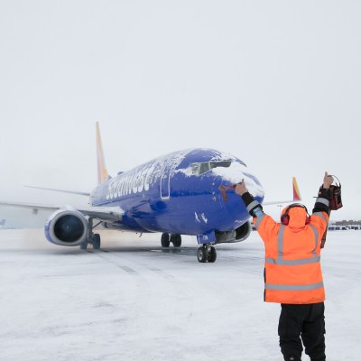 A Southwest Airlines plane on a snowy runway.