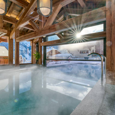 view of the mountains from an indoor pool