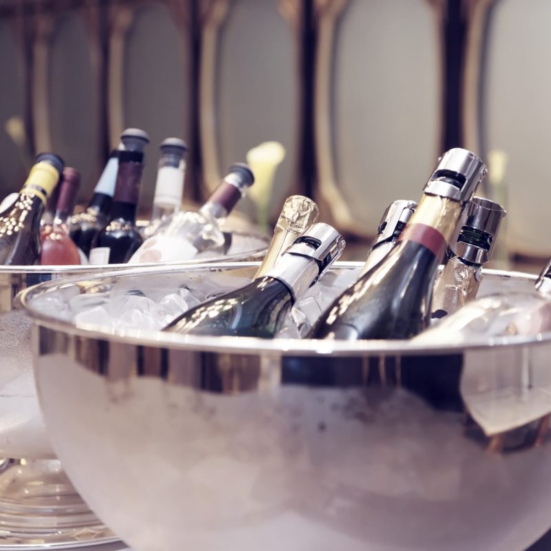 Bottles of champagne in ice buckets
