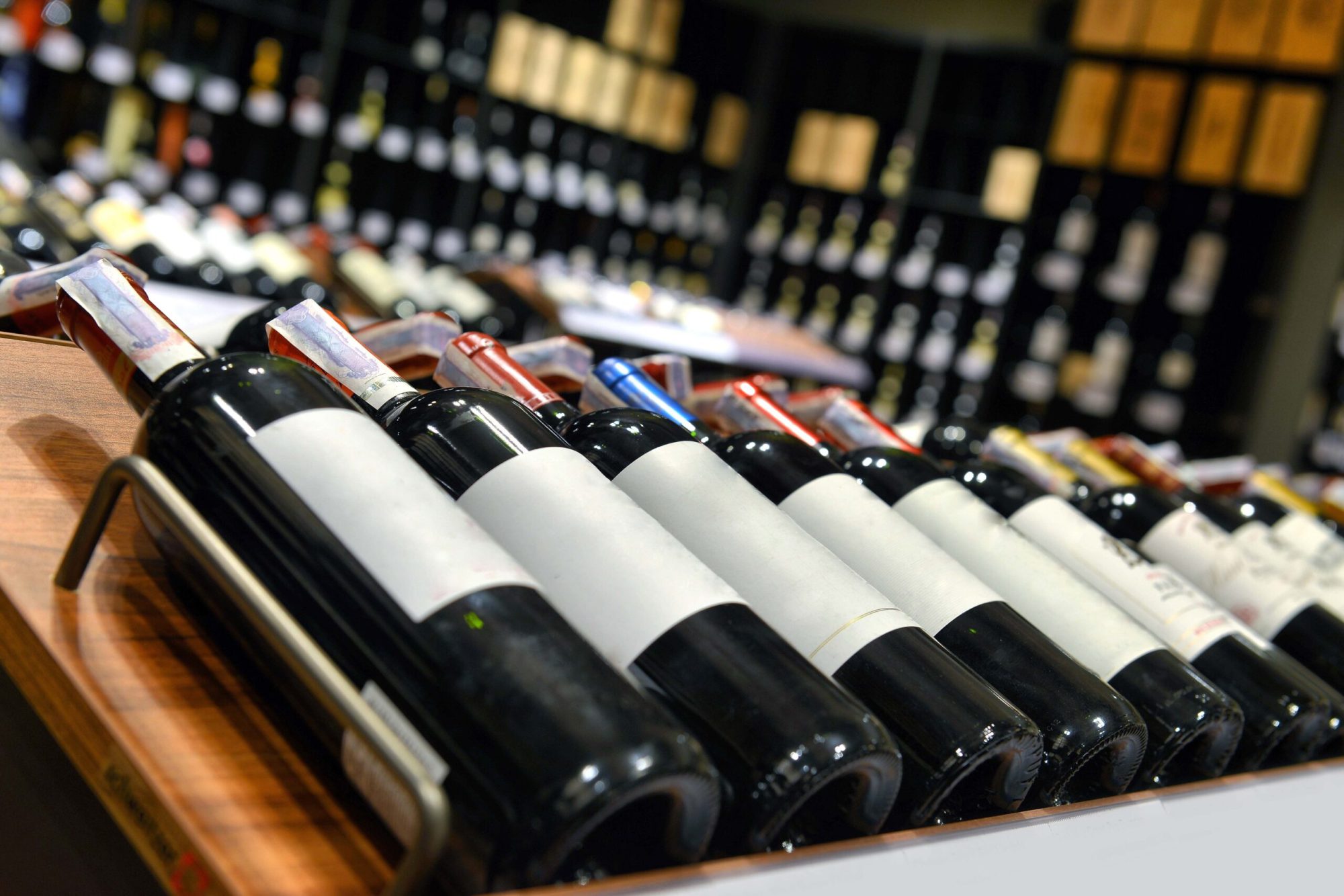 Collection of wine bottles on rack