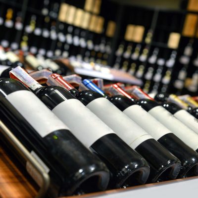 Collection of wine bottles on rack