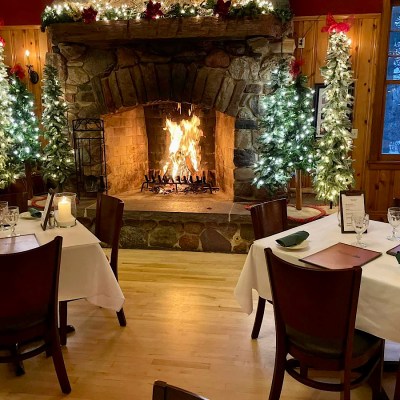 Dining by the fireplace at Timmer’s Resort