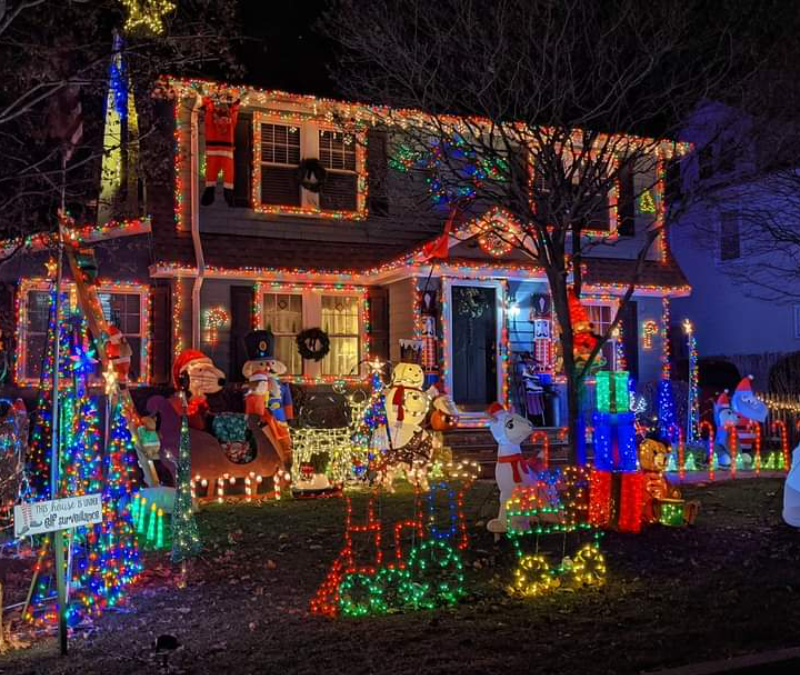 house decorated with Christmas lights at night