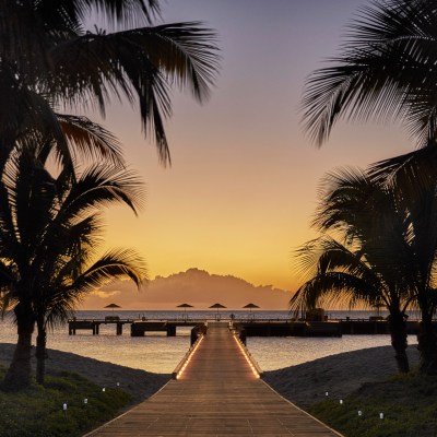 sunset beach boardwalk palm trees
