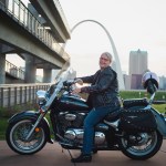 Teresa on her motorcycle in front of the Gateway Arch in St. Louis