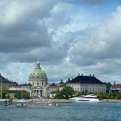View of the Marble Church, Amalienborg Palace, and the Frederik V statue from the Opera House across the harbor in Copenhagen