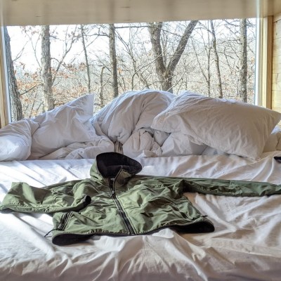 jacket laying on bed