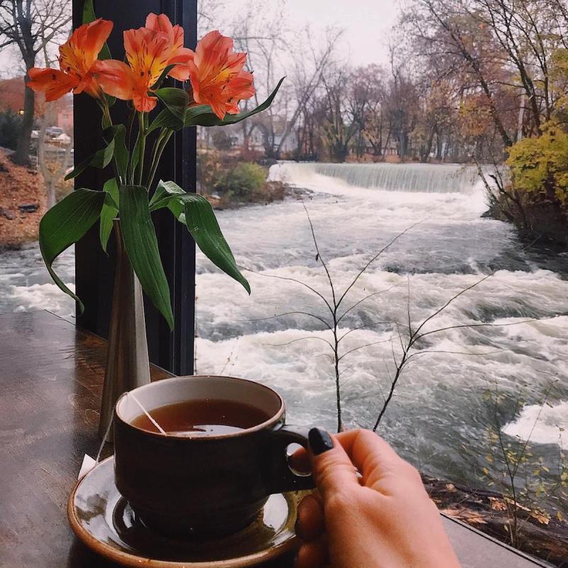 A cup of coffee overlooking Fishkill Falls at The Roundhouse in Beacon, New York