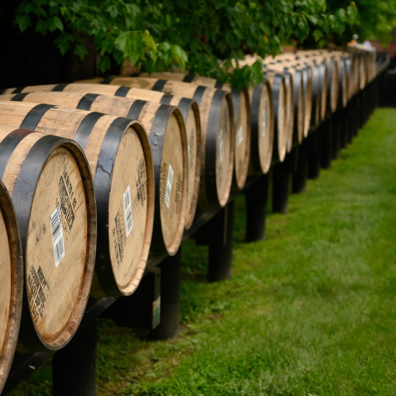 Line of Barrels Rolling into Warehouse along Kentucky bourbon trail