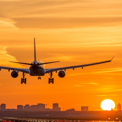 Airplane is landing during a nice early morning sunrise