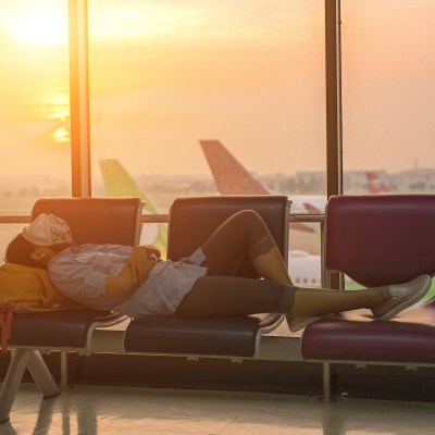 A woman sleeping in an airport