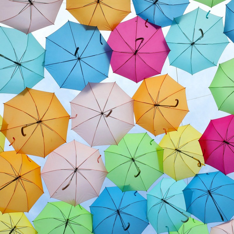 different colored umbrellas suspended in sky at Dollywood