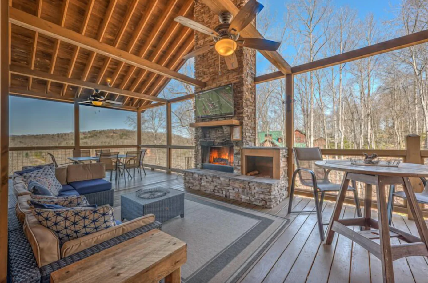 Georgia cabin vrbo deck fireplace with tv over it
