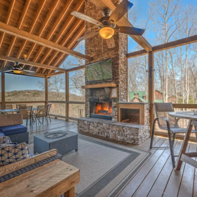 Georgia cabin vrbo deck fireplace with tv over it