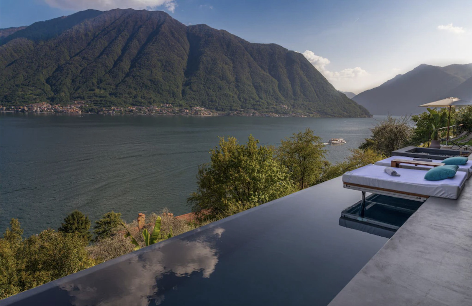 view of lake como from infinity pool at villa