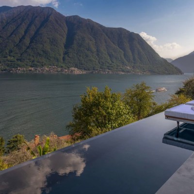 view of lake como from infinity pool at villa