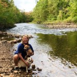 Deborah and her pups on the Battenkill River in Vermont during her 2021 Airstream trip across America.