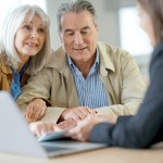Elderly couple meeting financial advisor