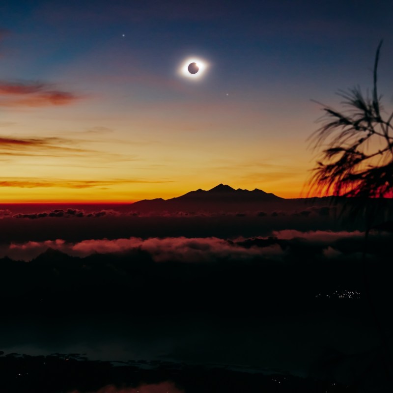 Solar eclipse on a colorful sky