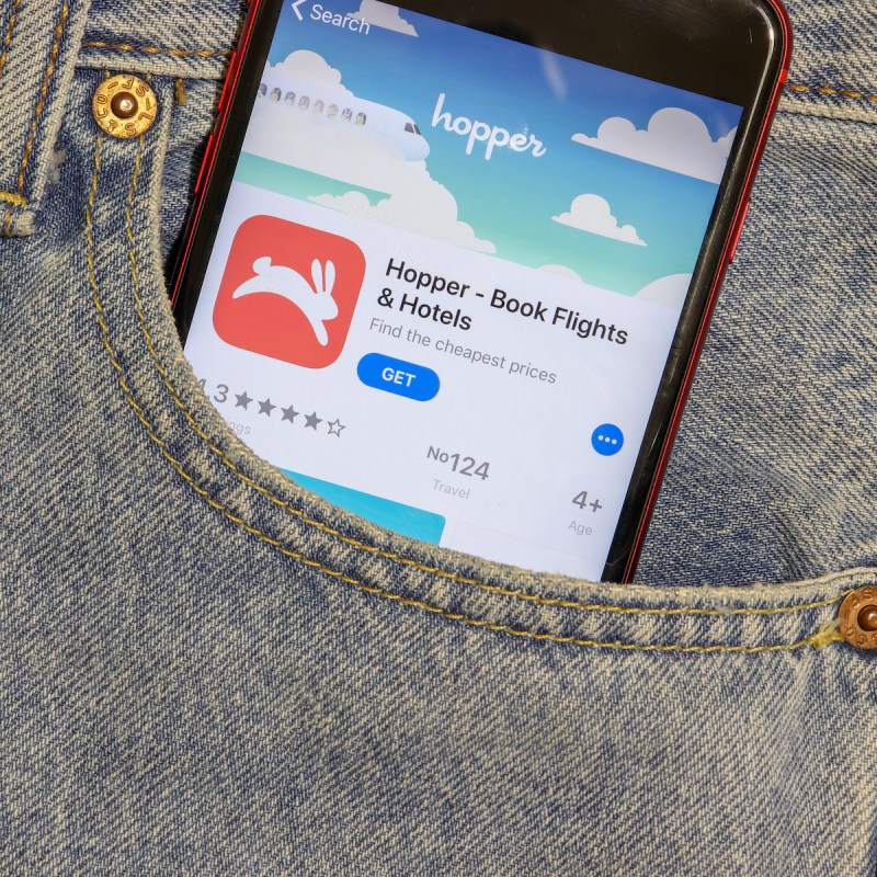 Hopper travel app on phone in pocket