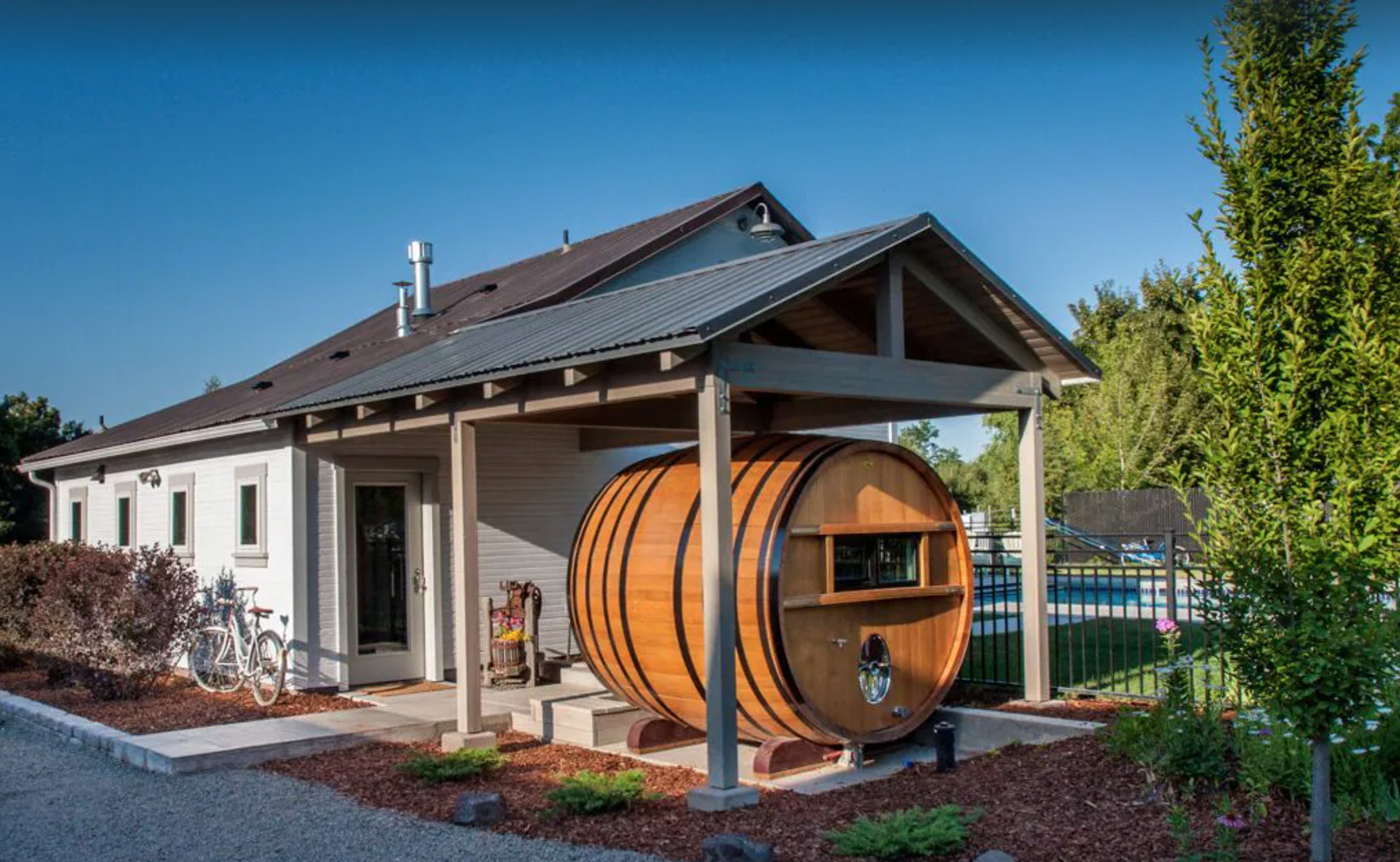 Giant wine barrel in front of house