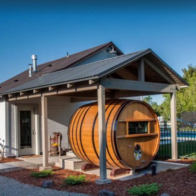 Giant wine barrel in front of house