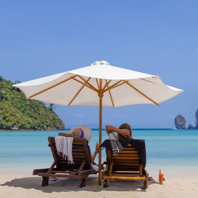 Mature couple relaxing on the beach in Thailand