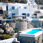 large white Grecian vacation rental with pool