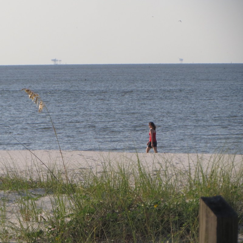 Taking a midday stroll along the East End Beach on Dauphin Island