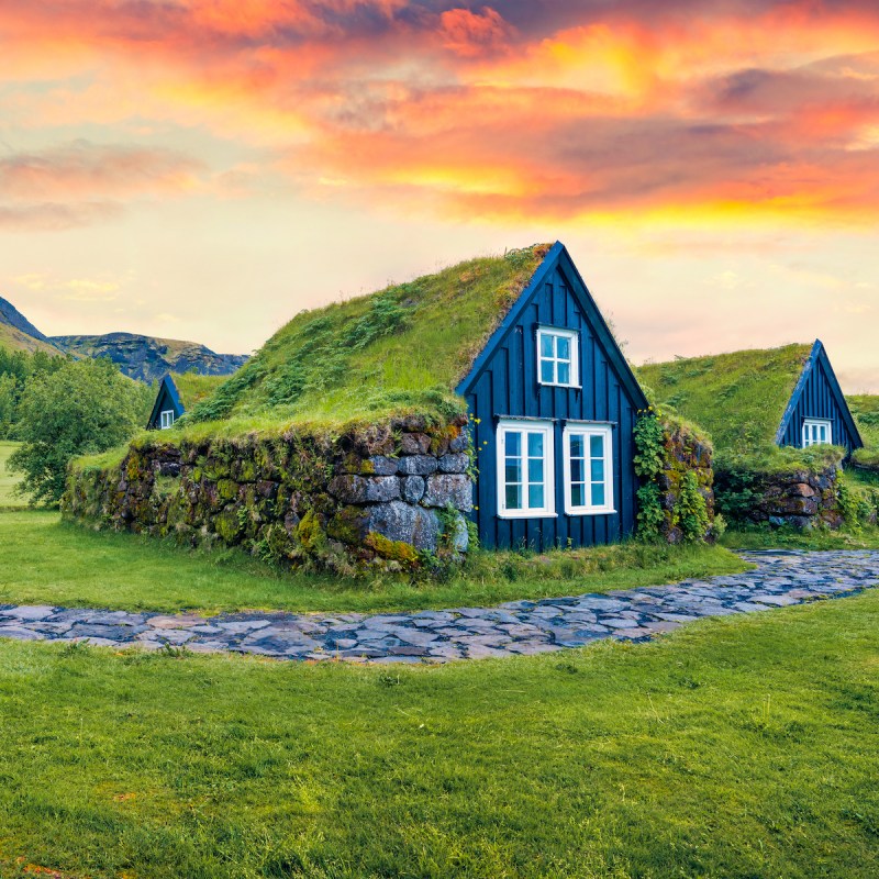Turf-top house in Iceland during sunrise