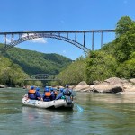 Preparing to hit the next rapid while whitewater rafting on the New River in West Virginia