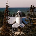 Aerial view of lighthouse shaped vacation rental Vrbo on Bois Blanc Island