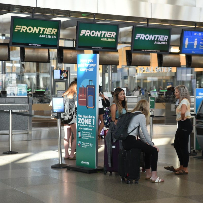 Passengers waiting at the Frontier Airlines check-in area
