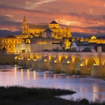 A night view of Cordoba across the Roman Bridge