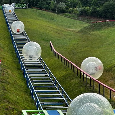 Zorbs being transferred up the hill at the Outdoor Gravity Park