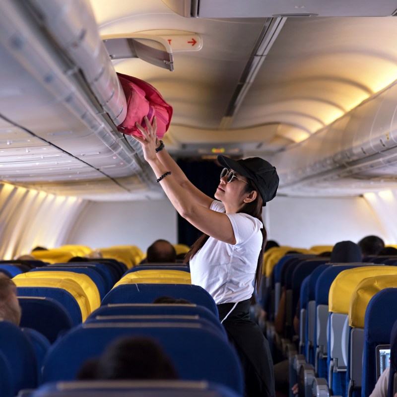 woman getting her luggage