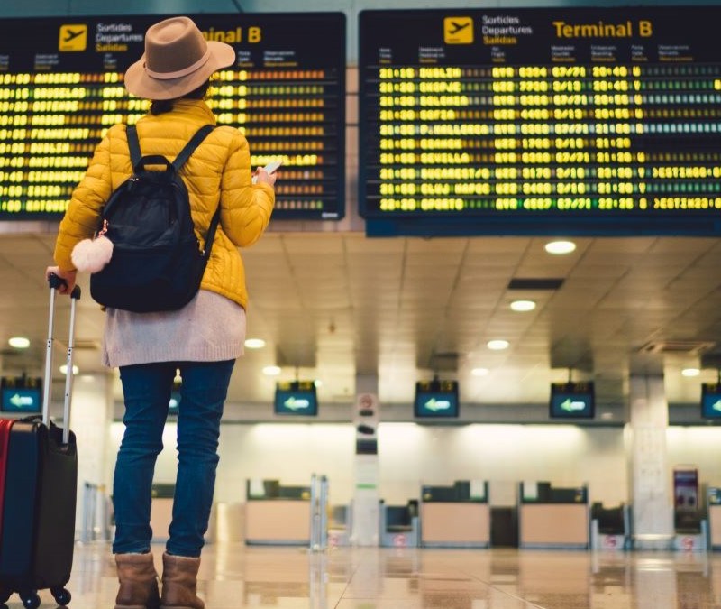 Traveler In Airport: Preparing for Cold and Flu Season: Travel Tips