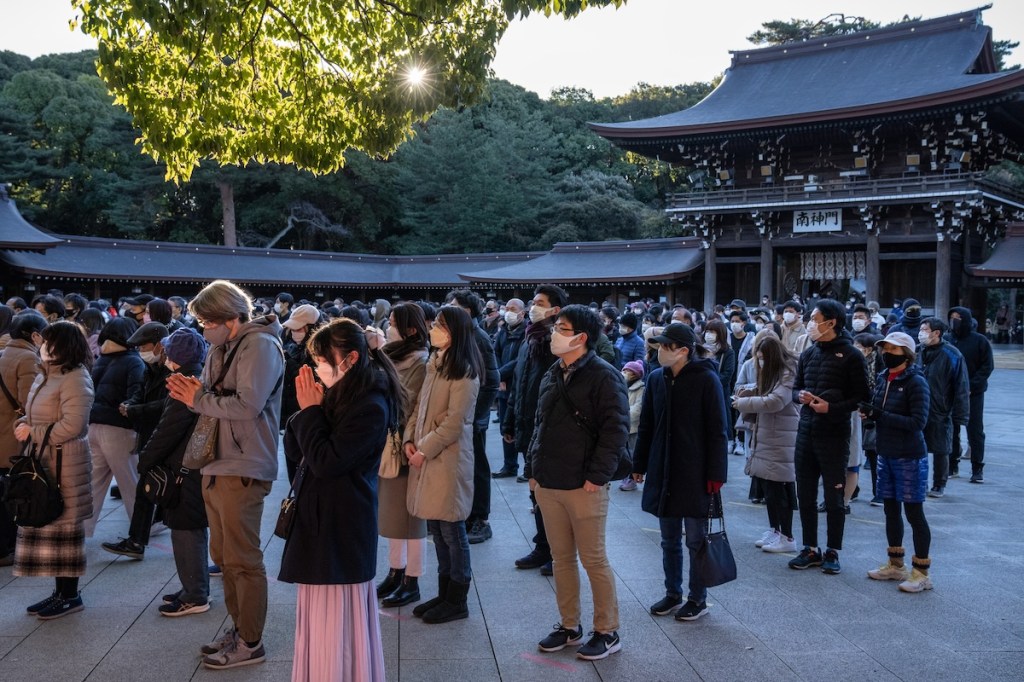 People pray for good luck in the new year at Meiji Shrine in Tokyo