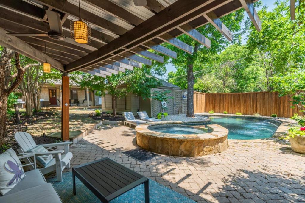 Backyard view of Sunset House - Luxury Pool and Hot Tub Retreat